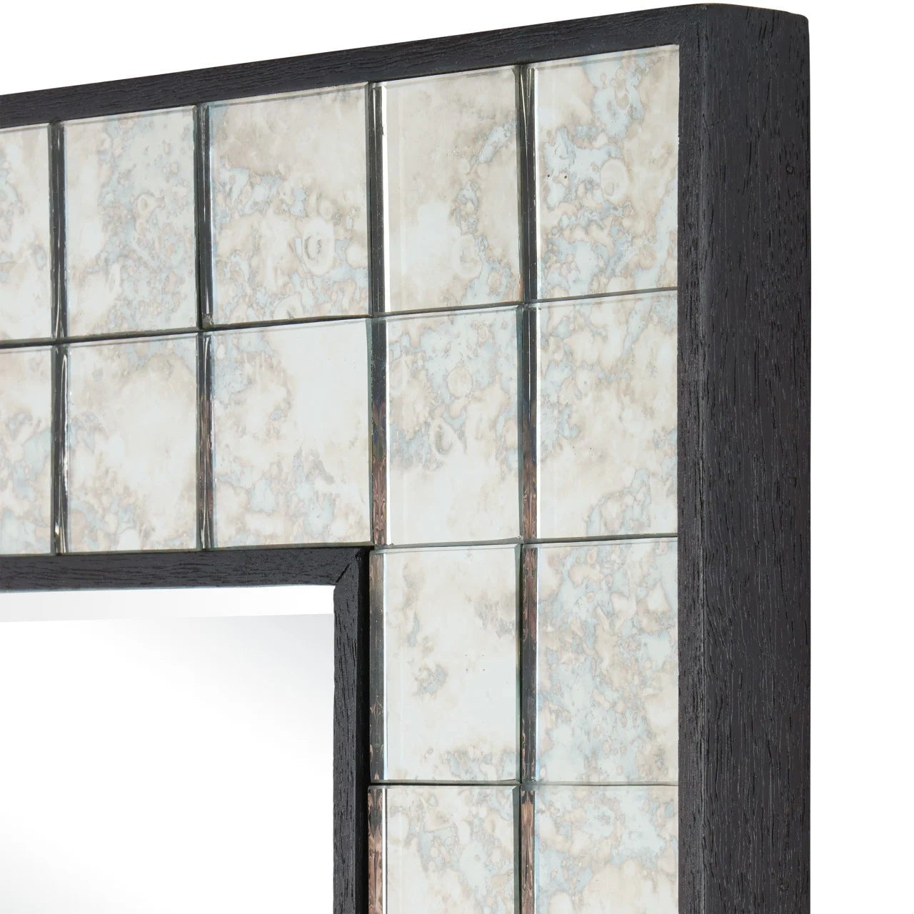 Decorative mirror with a black frame and glass panels on a white background