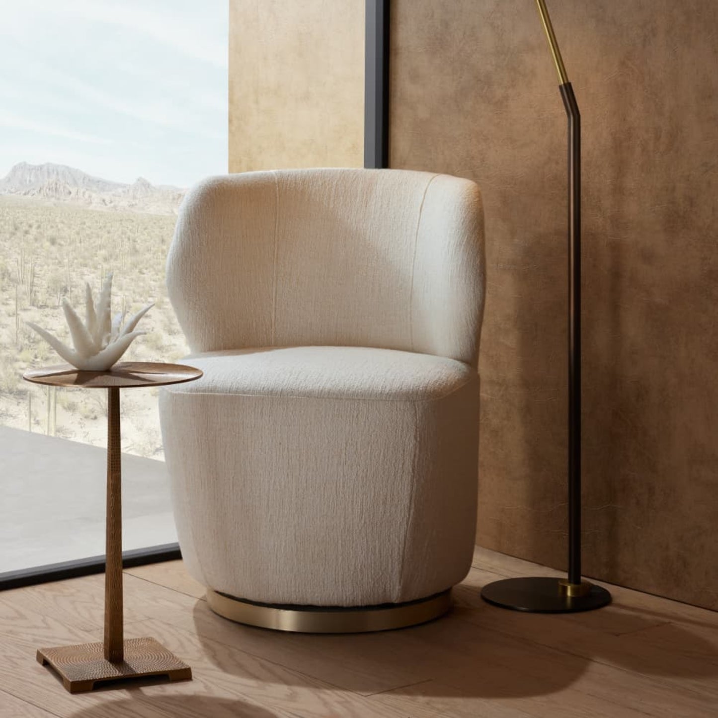 White armchair in a modern interior setting with a side table and floor lamp.