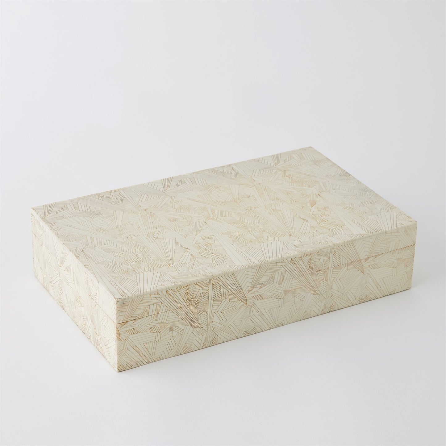 Rectangular beige box with a textured pattern on a white background