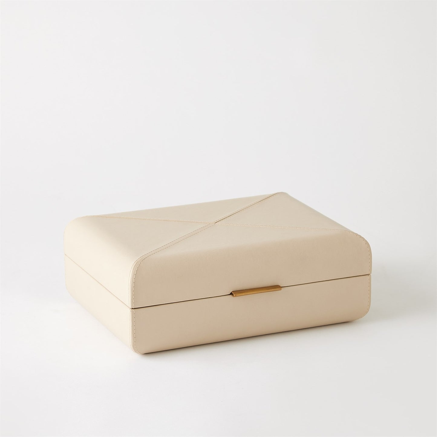 Beige jewelry box with a gold clasp on a white background