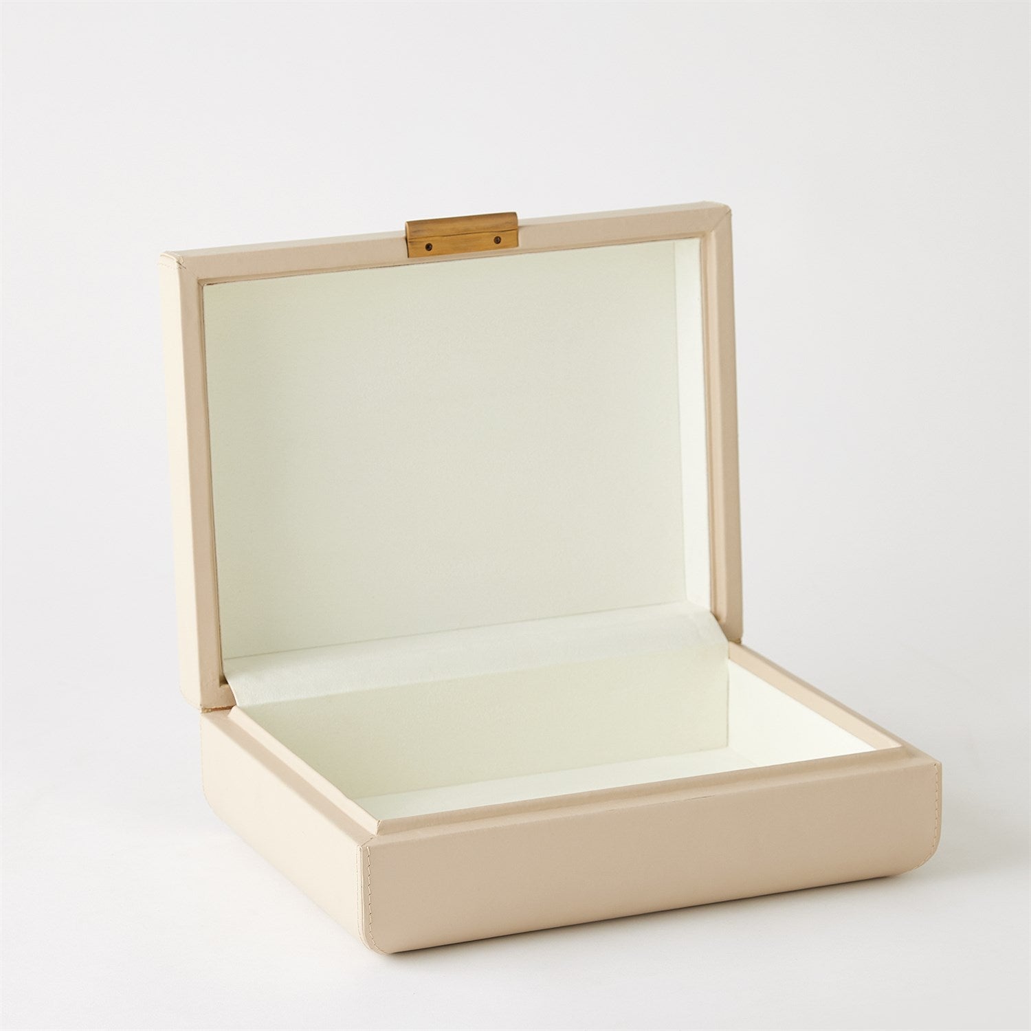Beige jewelry box with a clear lid on a white background