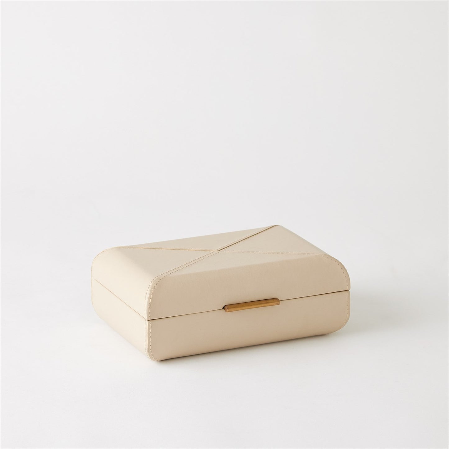 Beige jewelry box with a gold clasp on a white background