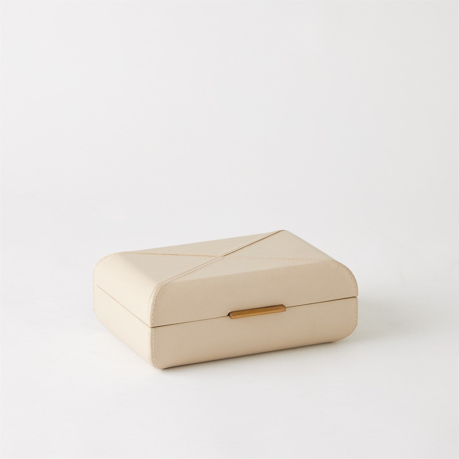 Beige jewelry box with a gold clasp on a white background