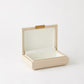 Beige jewelry box with a gold clasp on a white background