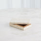 Wooden jewelry box with a textured surface on a white background