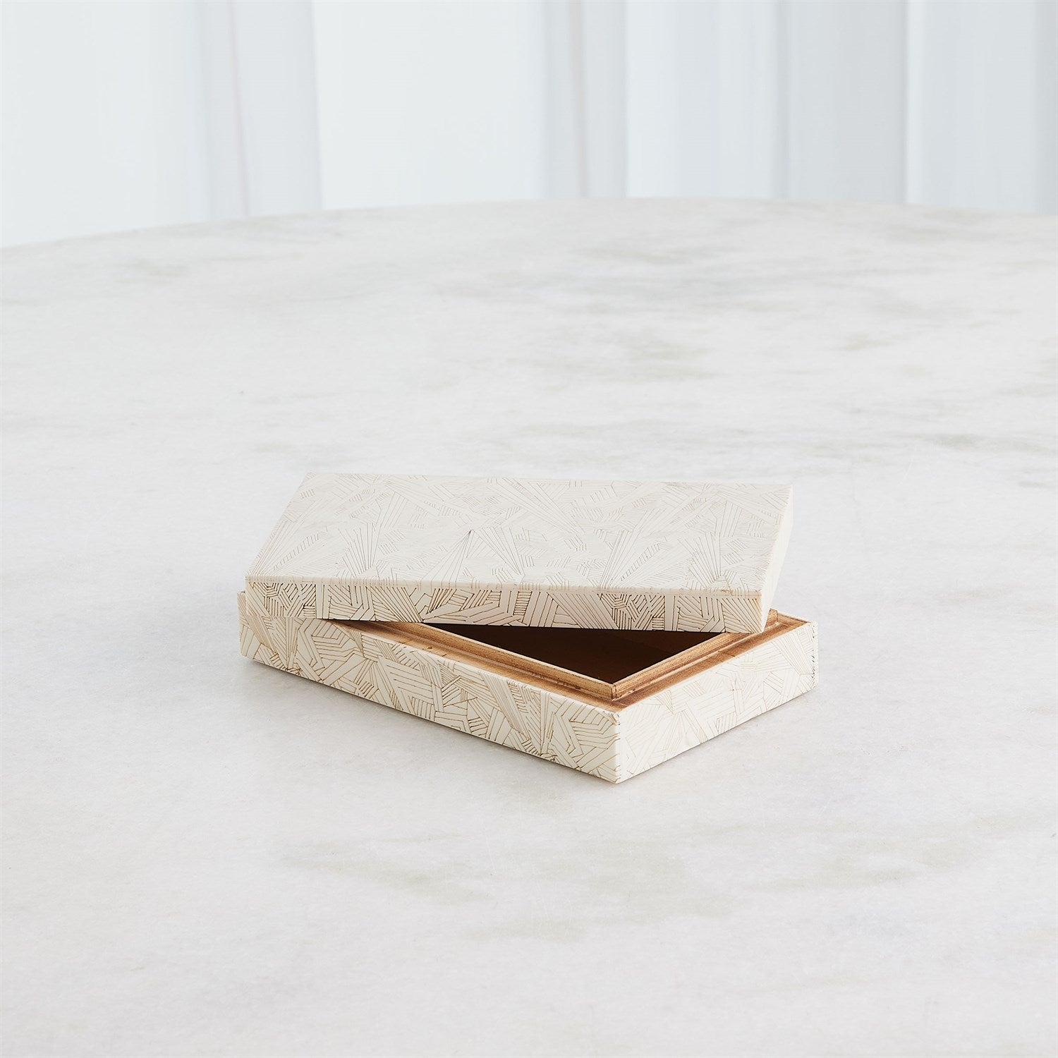 Wooden jewelry box with a textured surface on a white background