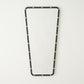 Rectangular mirror with black frame and gold studs on a white background