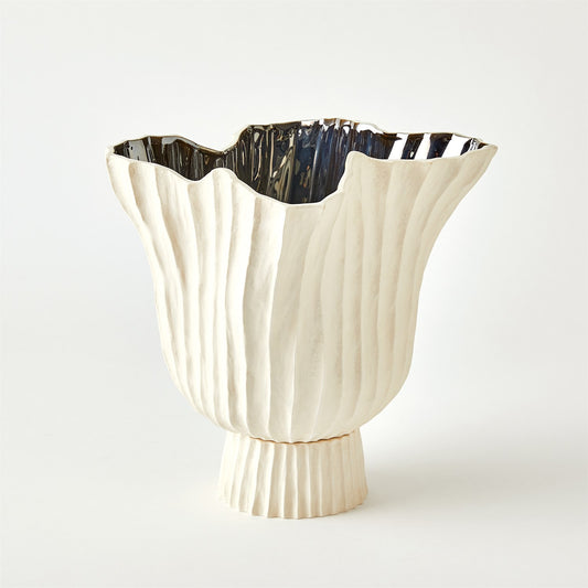 Decorative vase with a textured design on a white background