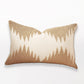 Decorative pillow with a gold and beige pattern on a white background