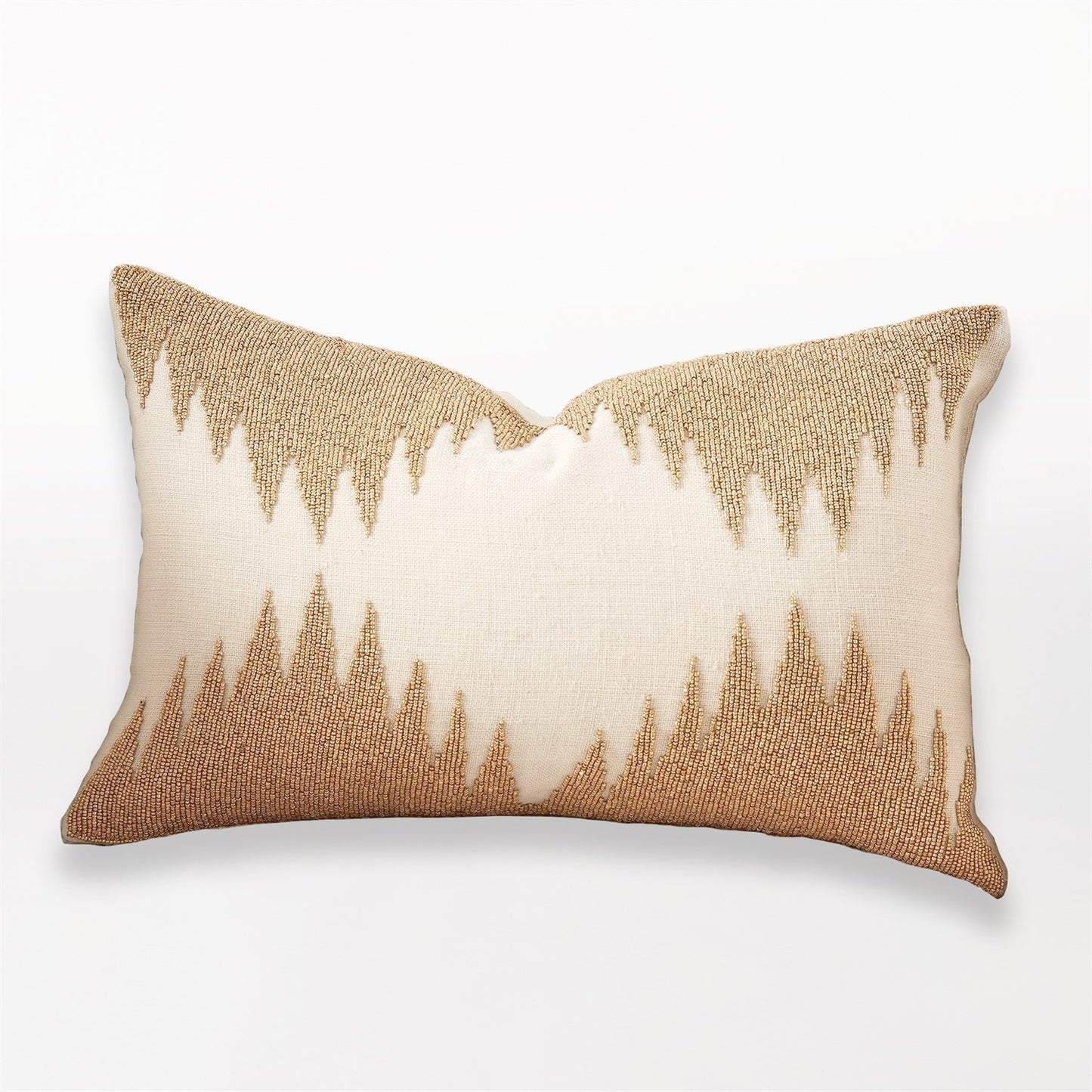 Decorative pillow with a gold and beige pattern on a white background