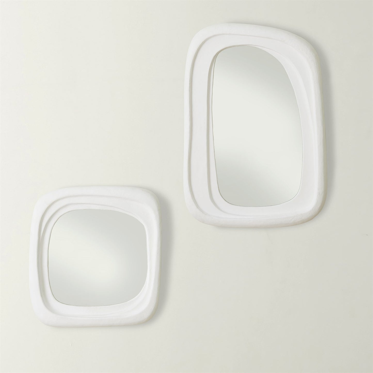 Two white rectangular mirrors on a light gray background