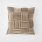 Beige woven pillow on a white background