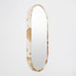 Round mirror with a decorative frame on a white background