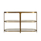 Gold console table with glass shelves on a white background