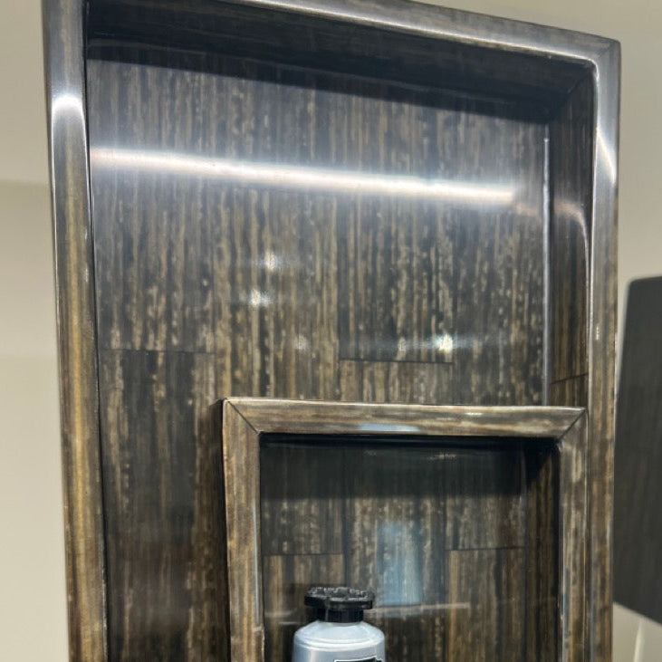 Decorative metal box with a mirror and a MARVYN product on a reflective surface.