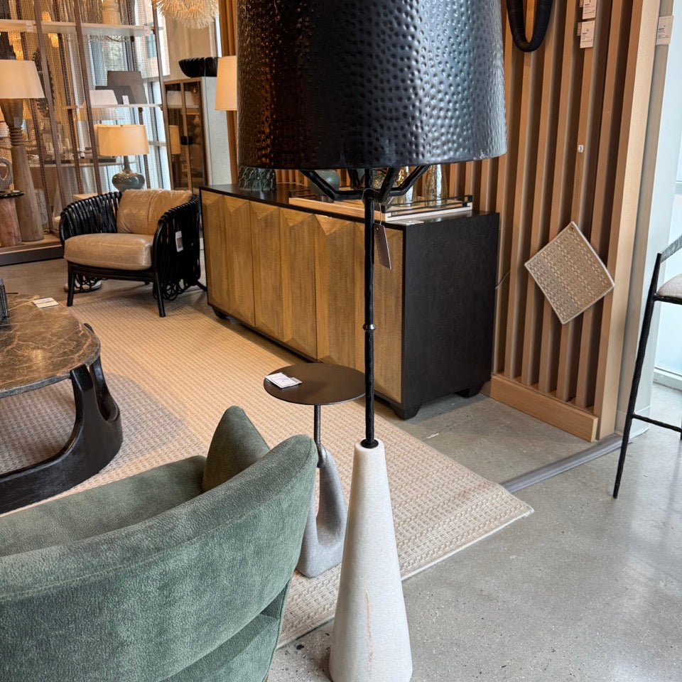 Modern interior with a black floor lamp and gray chair.
