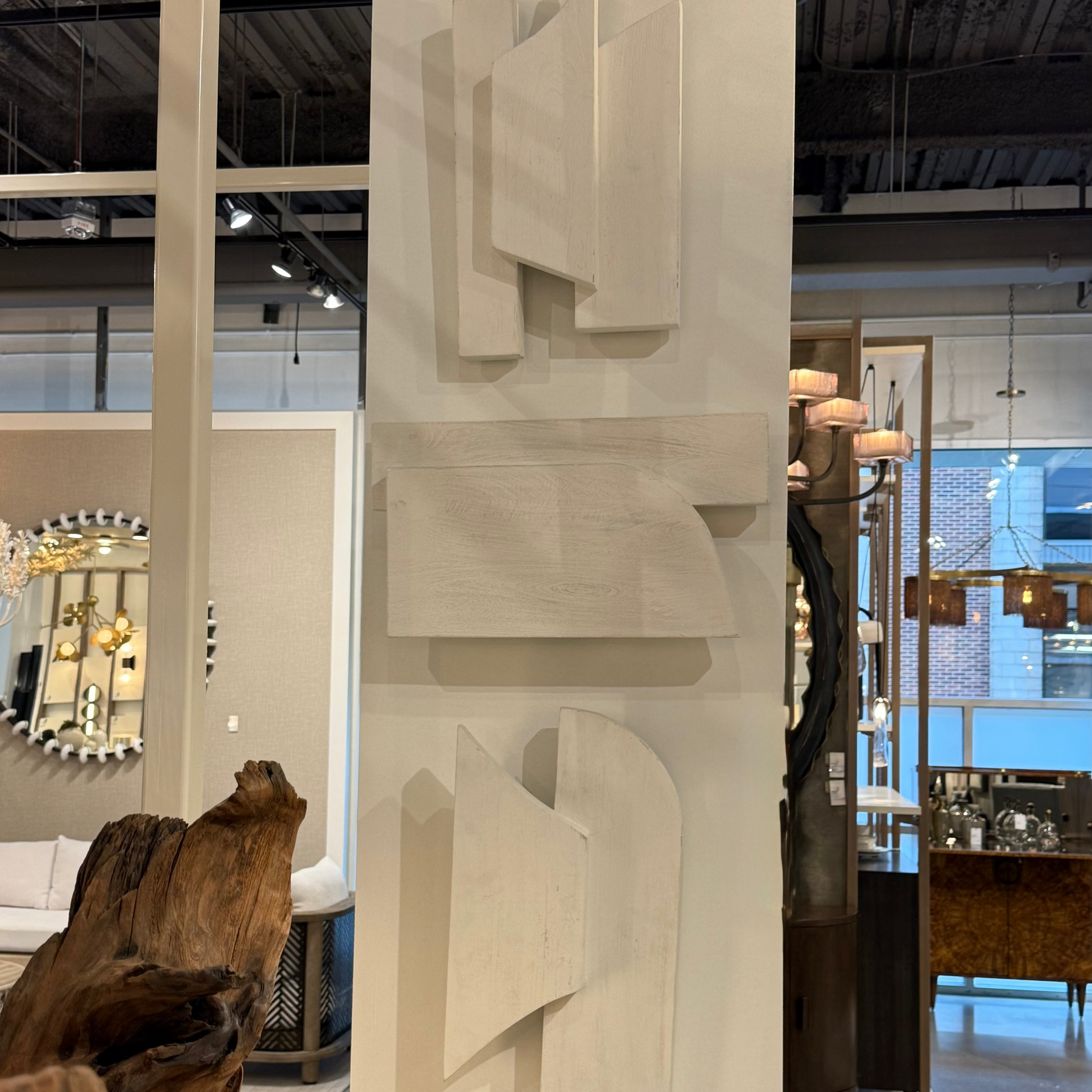 Modern interior design with abstract wall art and wooden elements.