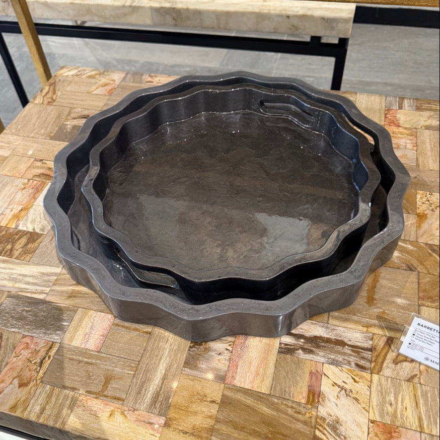 Black cast iron skillet on a wooden surface with a price tag visible