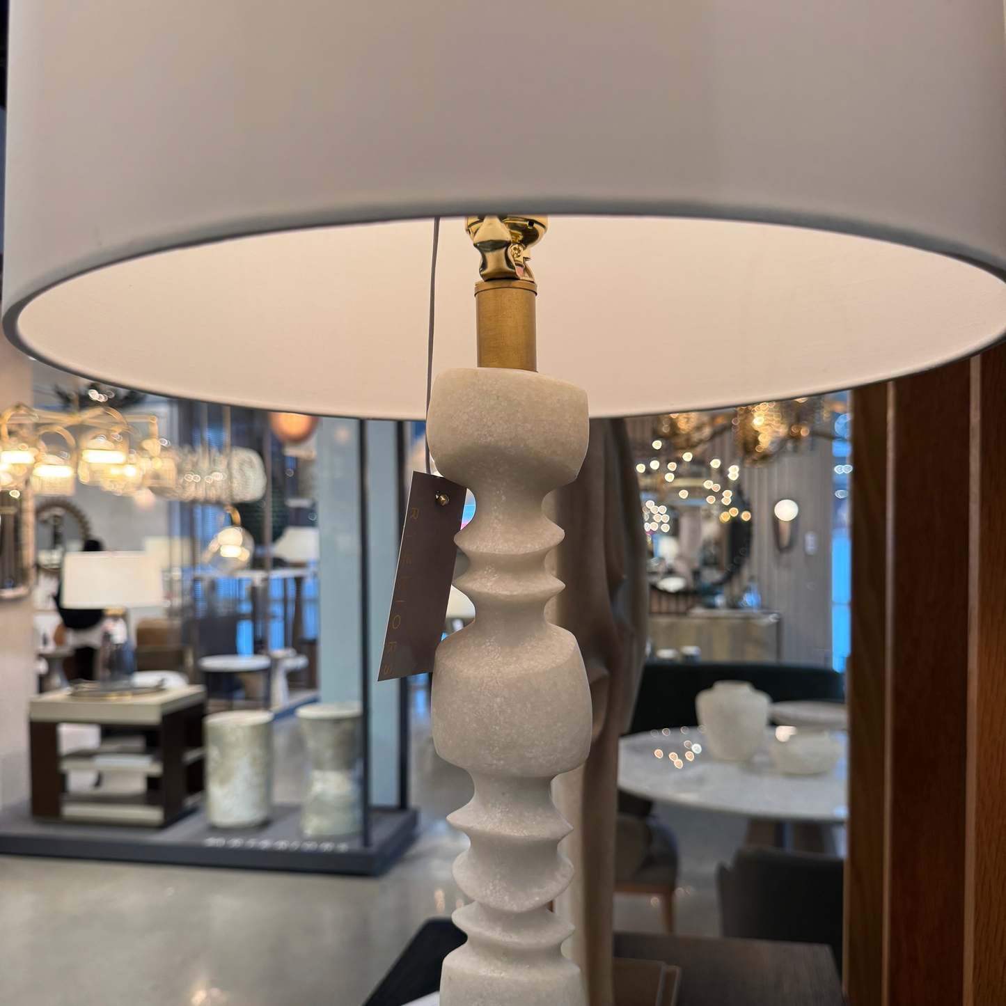 Decorative lamp with a textured base in a store setting