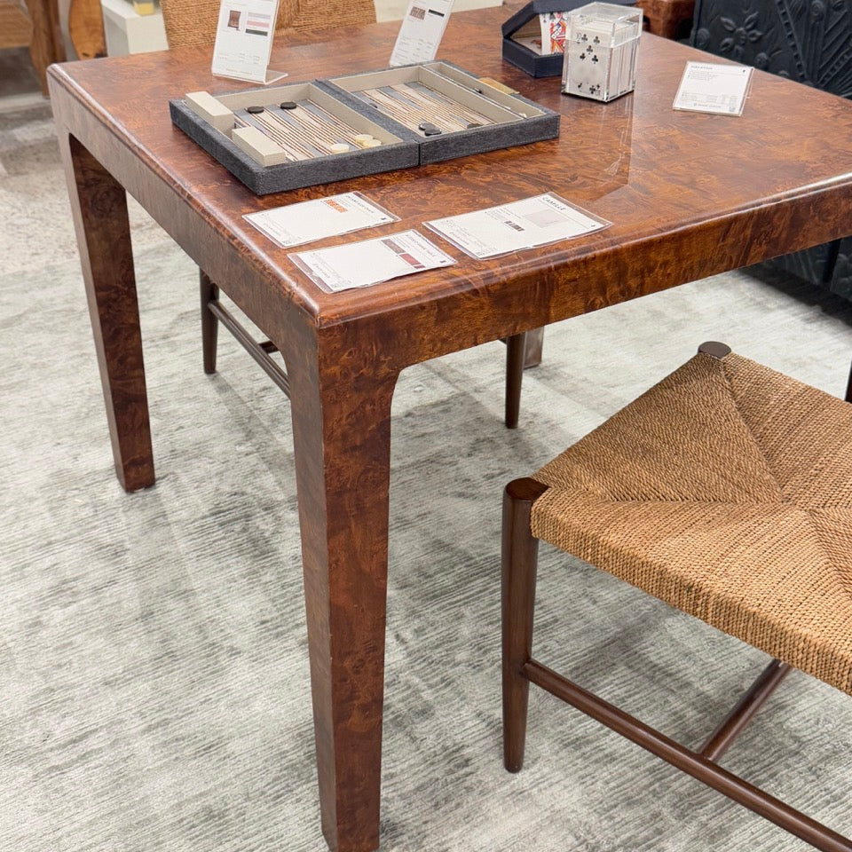 Wooden dining table with chairs in a showroom setting