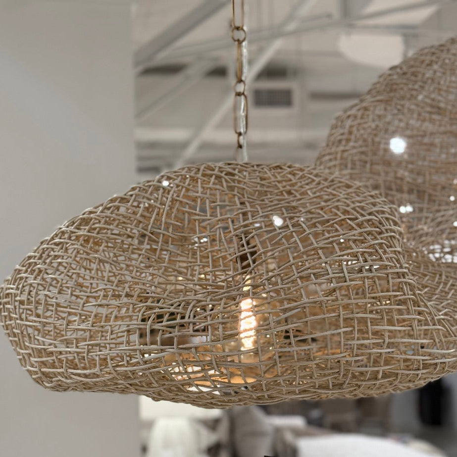 Woven pendant light with 'NEW' tag in a store setting