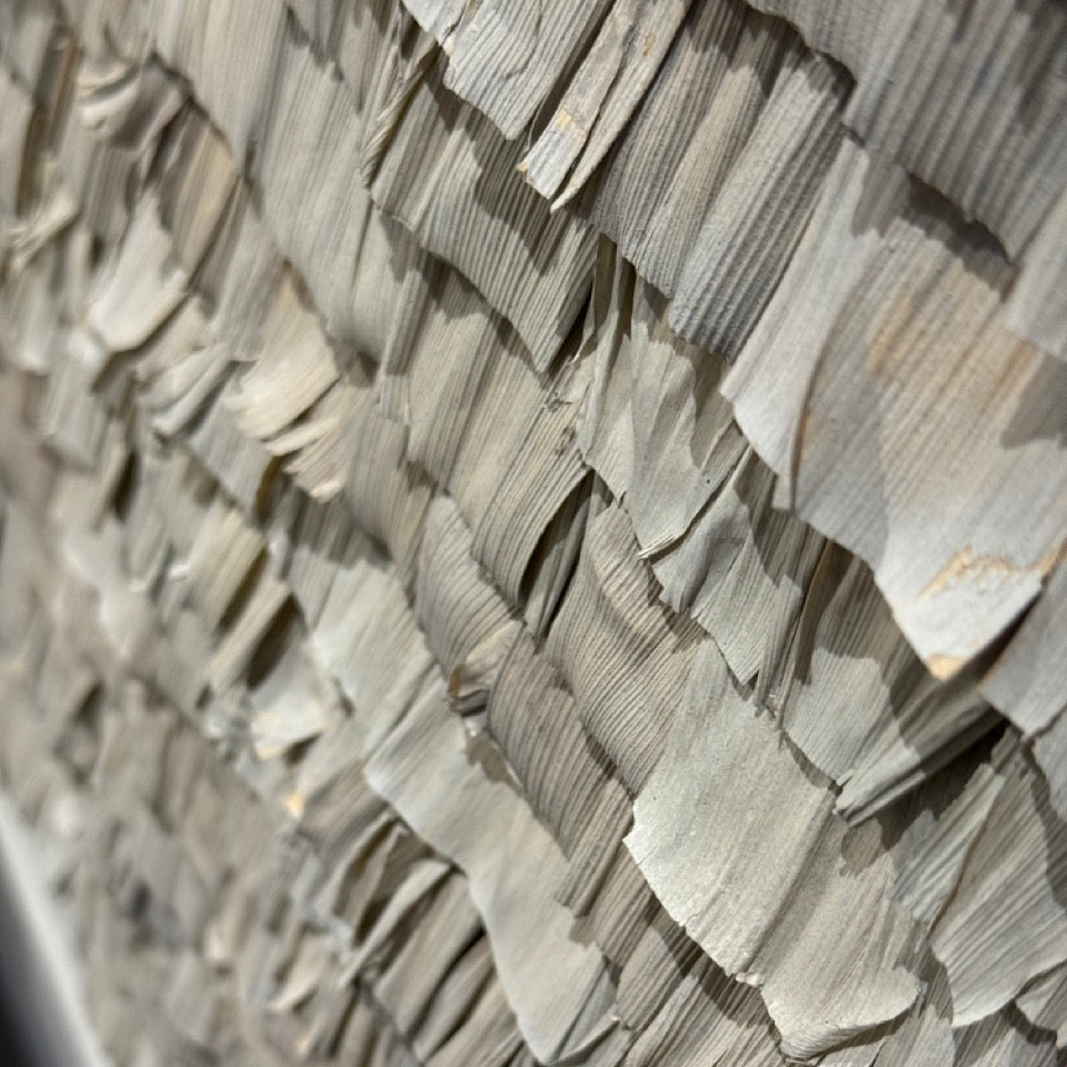 Close-up of a textured wall with wavy stone patterns