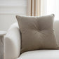 Brown pillow with a button on a white background