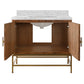 A modern bathroom vanity cabinet with a warm medium-brown wood finish, open doors, a white marble countertop, and a gold-finished metal frame, shown on a plain white background.