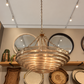 Hetty Chandelier Smoke Resin and Gold in a showroom