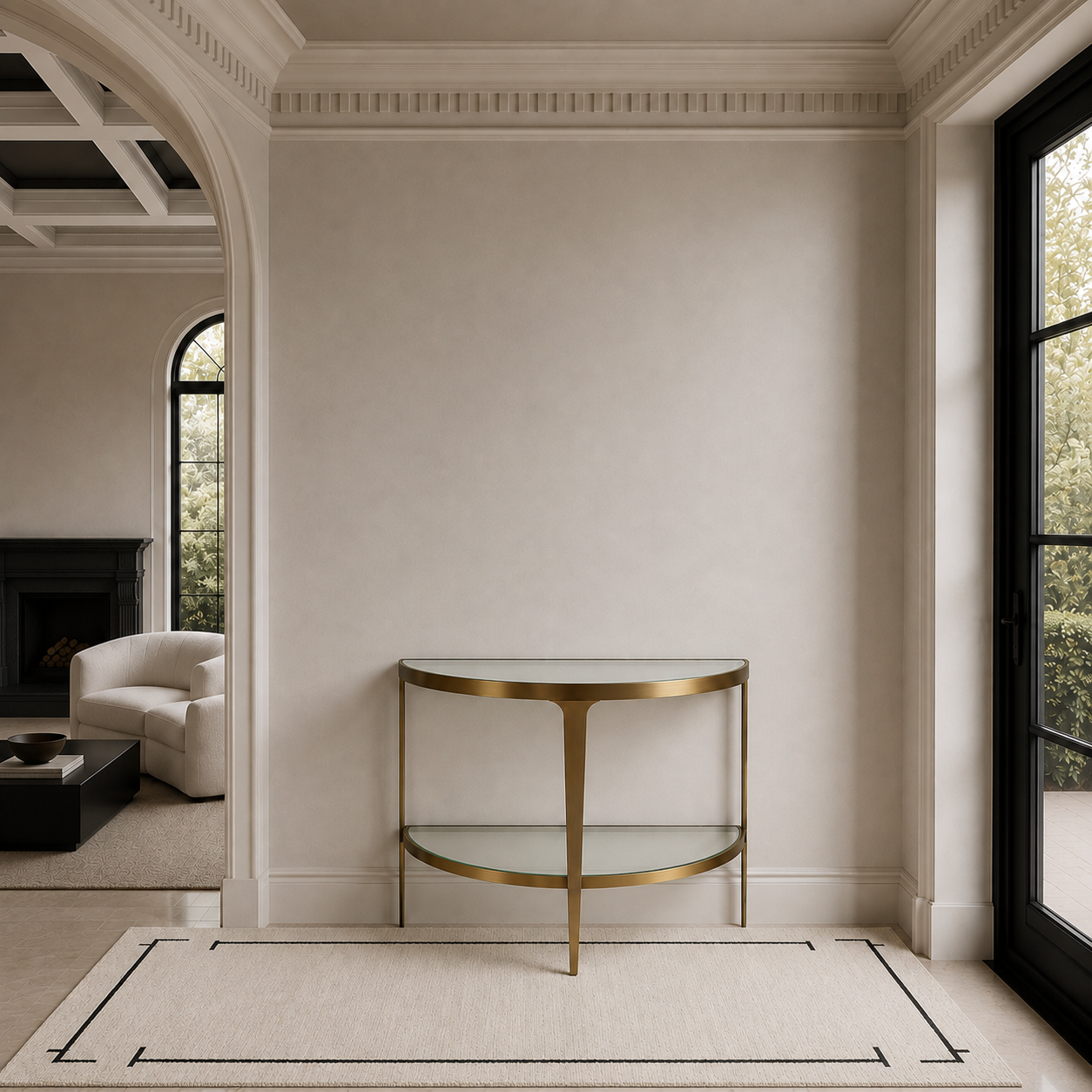 A modern console table with a gold metal frame and two glass shelves, positioned against a neutral beige wall in a beautifully styled interior room.