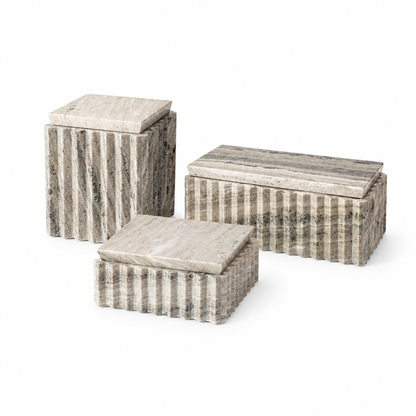 Three rectangular stone storage boxes with lids, arranged in a nested set on a white background. The boxes feature a fluted exterior with vertical striations and a polished stone top surface.