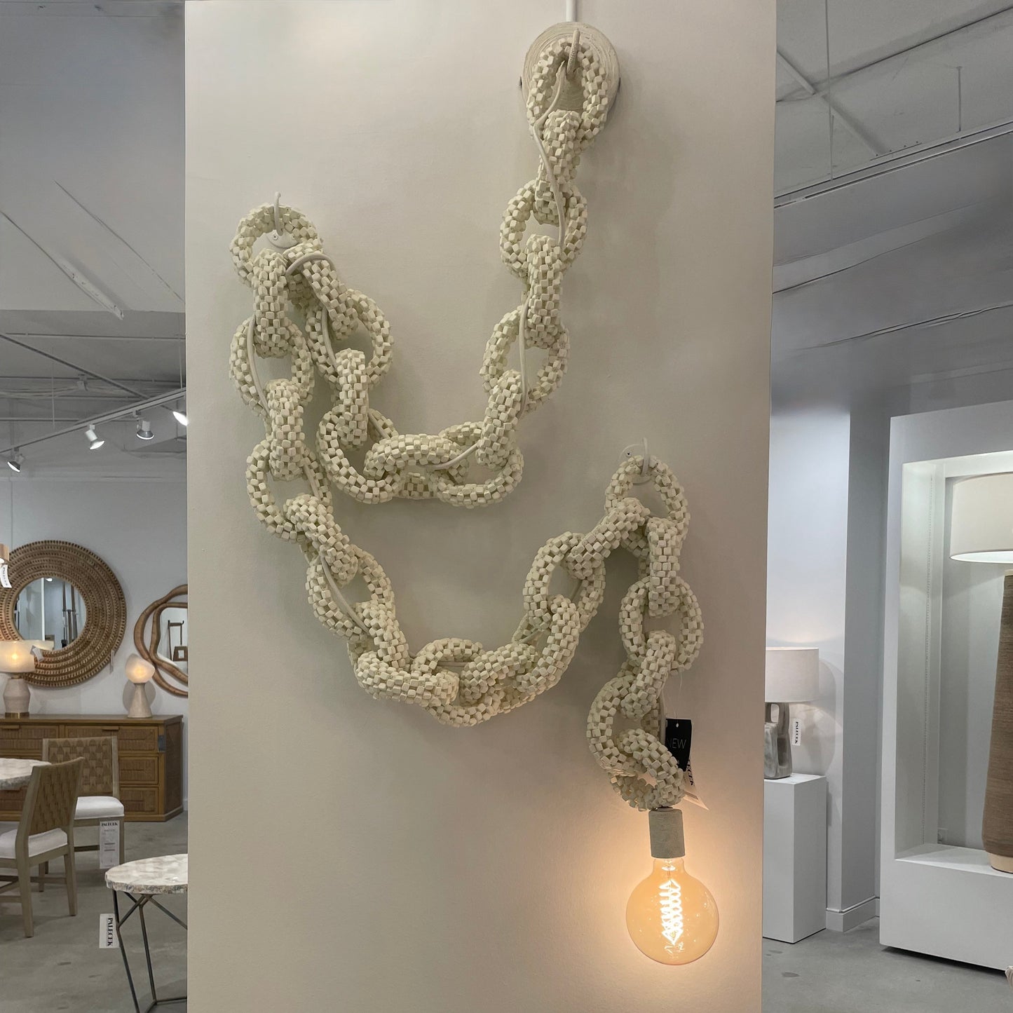 Decorative rope light fixture on a wall in an interior setting