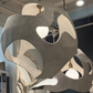 Modern chandelier with geometric design in a showroom setting