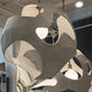 Modern chandelier with geometric design in a showroom setting