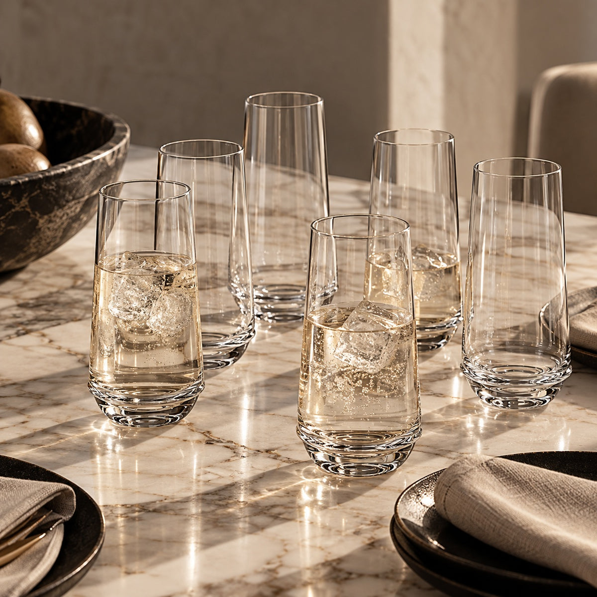 Dune Clear Glass Tumblers set out on a marble table set