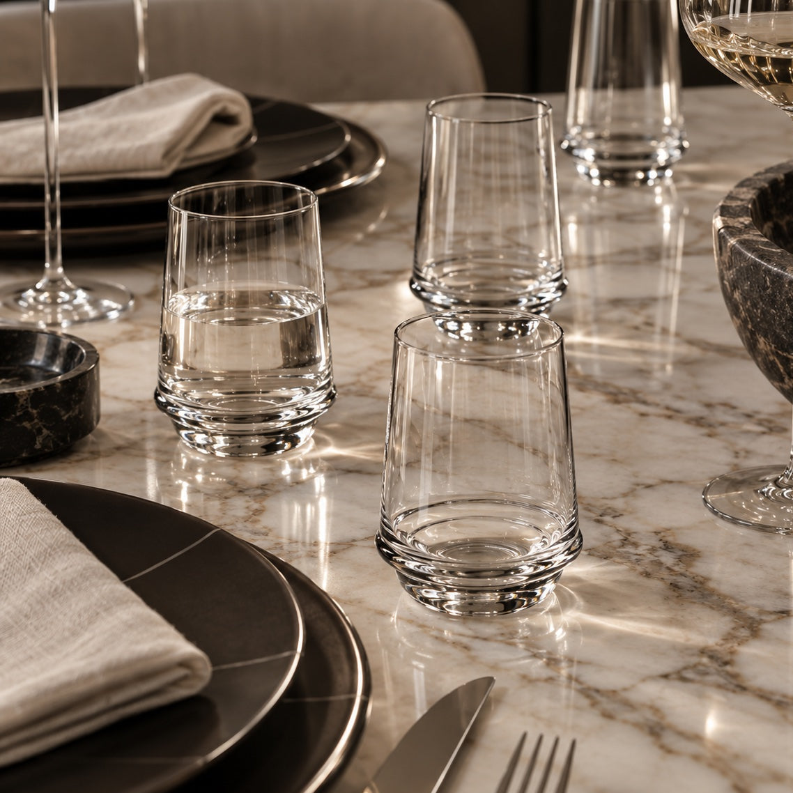 Clear Short Tumbler Glasses on a marble table