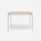 Rectangular table with a light beige top and silver frame on a white background