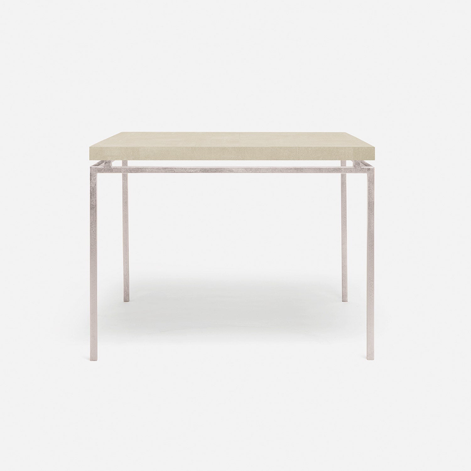 Rectangular table with a light beige top and silver frame on a white background