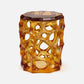 Hexagonal amber-colored stool with a unique lattice design on a white background