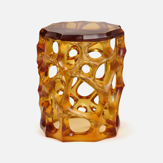 Hexagonal amber-colored stool with a unique lattice design on a white background