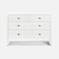 A modern white five-drawer dresser with small rectangular brass handles, shown against a plain light gray background.