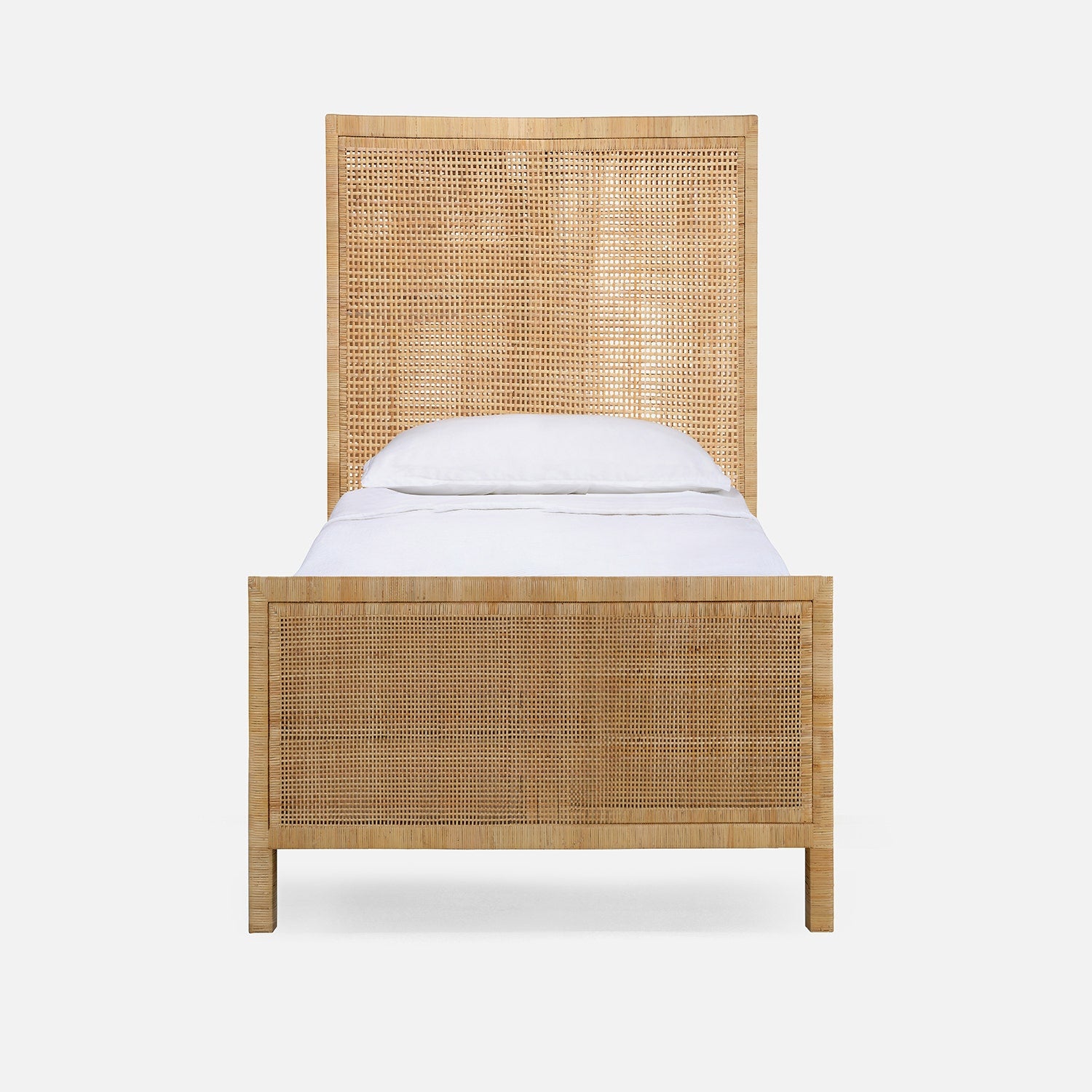Wicker bed with white mattress on a white background