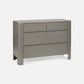Gray dresser with three drawers on a white background