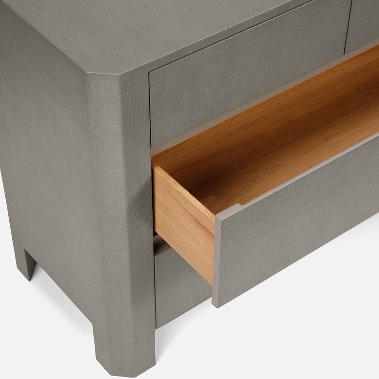 Gray dresser with a wooden drawer open on a white background