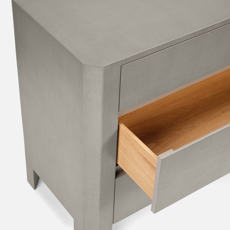 Gray dresser with an open wooden drawer on a white background