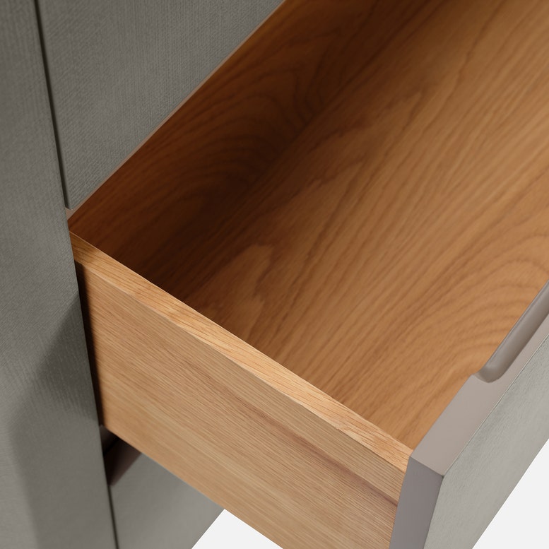 Close-up of a wooden drawer with gray frame