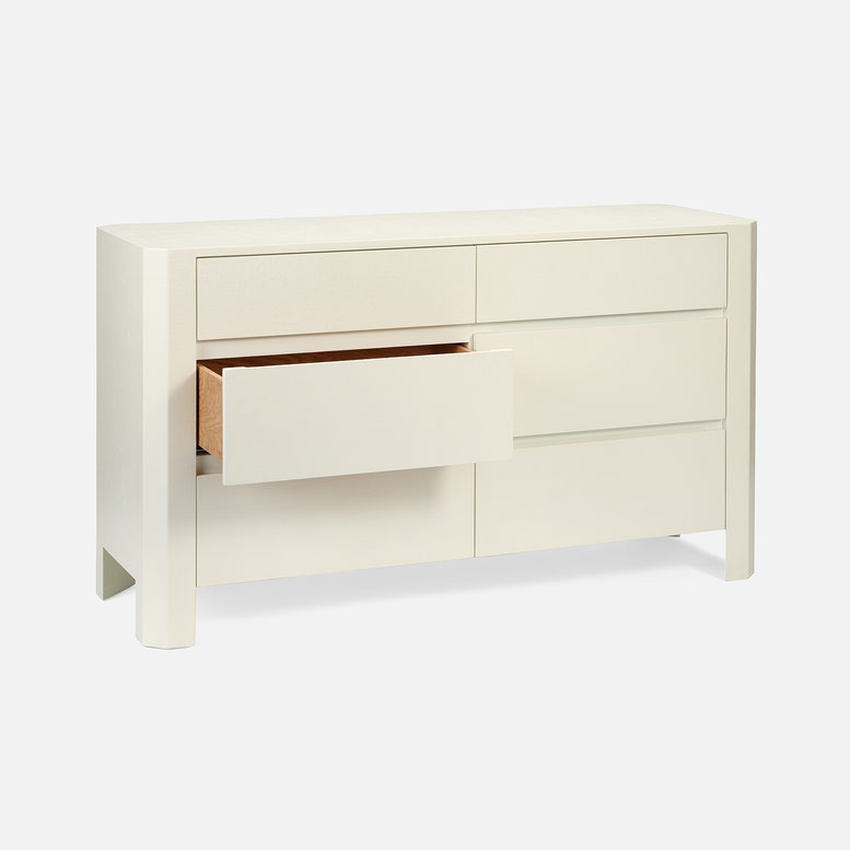 White dresser with open drawer on a white background