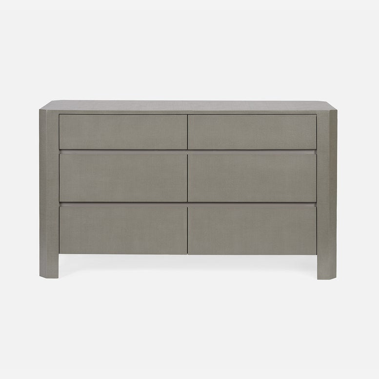 Gray dresser with four drawers on a white background