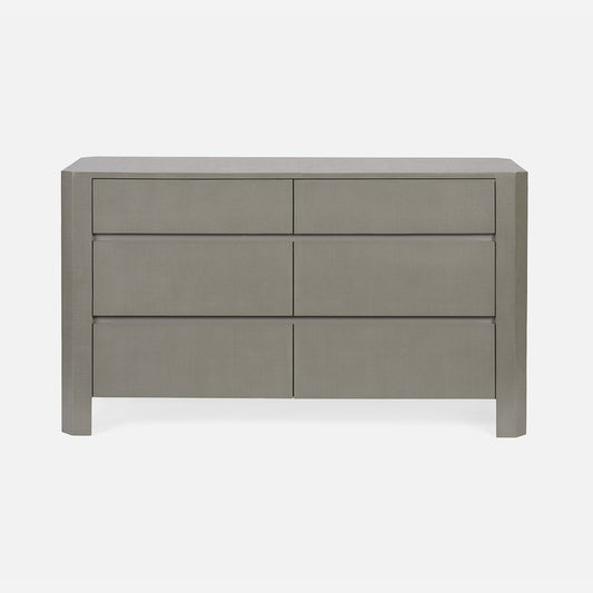Gray dresser with four drawers on a white background