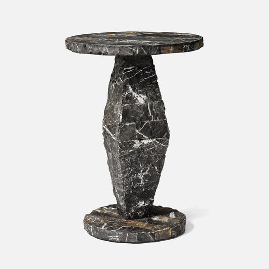 Marble side table with a unique design on a white background